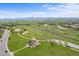 Aerial view showcasing a green park with walking trails and playground equipment, perfect for outdoor activities at 1513 Cannon Mountain Dr, Longmont, CO 80503