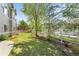 Spacious backyard featuring a lawn, white fence and mature trees at 1513 Cannon Mountain Dr, Longmont, CO 80503