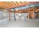 Unfinished basement with staircase, exposed ductwork and windows at 1513 Cannon Mountain Dr, Longmont, CO 80503