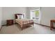 Bright bedroom featuring a large window, neutral carpet, and furnishings at 1513 Cannon Mountain Dr, Longmont, CO 80503