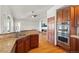 Kitchen with stainless steel appliances and granite countertops, open to the living room at 1513 Cannon Mountain Dr, Longmont, CO 80503