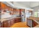 Modern kitchen with stainless steel appliances, granite countertops, and ample cabinet space at 1513 Cannon Mountain Dr, Longmont, CO 80503
