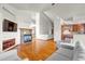 Spacious living room with hardwood floors, fireplace, and open floor plan at 1513 Cannon Mountain Dr, Longmont, CO 80503