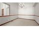 Spacious, carpeted room with base molding and large window, perfect for relaxing or entertaining guests at 1513 Cannon Mountain Dr, Longmont, CO 80503