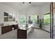 Bright home office with large windows, a built-in desk, and ample storage space at 1513 Cannon Mountain Dr, Longmont, CO 80503