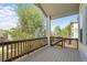 Overhead view of the spacious wood patio with a view of the lawn and mature trees at 1513 Cannon Mountain Dr, Longmont, CO 80503