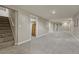 Spacious finished basement with new carpet, lighting, and easy access to upstairs at 7301 Dale Ct, Westminster, CO 80030