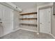 Partially-finished basement bedroom with shelving at 7301 Dale Ct, Westminster, CO 80030