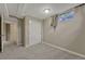 Carpeted bedroom with closet, window, and doorway at 7301 Dale Ct, Westminster, CO 80030