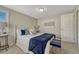 Bright bedroom is well lit with a queen bed and fresh paint, and plenty of natural light at 7301 Dale Ct, Westminster, CO 80030