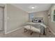Bedroom with neutral walls, soft carpet, and a large window that brings in natural light at 7301 Dale Ct, Westminster, CO 80030