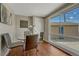 Cozy dining area with a glass table and a large window overlooking the backyard at 7301 Dale Ct, Westminster, CO 80030