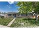 Charming single-story home featuring blue shutters and a well-maintained front yard at 7301 Dale Ct, Westminster, CO 80030
