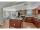 Stylish kitchen with granite counters, stainless appliances and adjacent dining area at 7301 Dale Ct, Westminster, CO 80030
