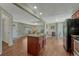 Bright kitchen boasts an island with granite countertops and stainless steel appliances at 7301 Dale Ct, Westminster, CO 80030