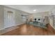 Bright living room with hardwood floors, a large window, and stylish furnishings at 7301 Dale Ct, Westminster, CO 80030