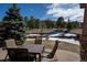 Enjoy outdoor dining on the patio with comfortable seating and views of the landscaped yard at 20217 Kenneth Lainer Dr, Monument, CO 80132