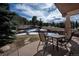 Outdoor patio boasts a seating area with natural landscaping and neighborhood views at 20217 Kenneth Lainer Dr, Monument, CO 80132