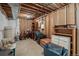 Unfinished basement space with exposed beams and some building materials at 20217 Kenneth Lainer Dr, Monument, CO 80132