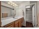 Well-lit bathroom features modern vanity with a shower behind a glass door at 20217 Kenneth Lainer Dr, Monument, CO 80132