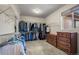 Walk-in closet with white wire shelving, two dressers and a window allowing in natural light at 20217 Kenneth Lainer Dr, Monument, CO 80132