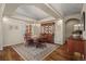 Formal dining room with hardwood floors, custom cabinetry, and elegant chandelier at 20217 Kenneth Lainer Dr, Monument, CO 80132