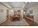 This dining room features hardwood floors, neutral walls, and access to a half bathroom at 20217 Kenneth Lainer Dr, Monument, CO 80132