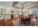 Formal dining room features a tray ceiling, hardwood floors, and a large window for natural light at 20217 Kenneth Lainer Dr, Monument, CO 80132