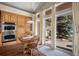 Kitchen with an eat-in table, wooden cabinetry, and access to the outdoor patio at 20217 Kenneth Lainer Dr, Monument, CO 80132