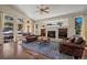 Bright living room with a fireplace, built-in shelving, and large windows at 20217 Kenneth Lainer Dr, Monument, CO 80132