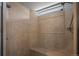 The bathroom features a tiled shower with a rain shower head and a built-in bench at 20217 Kenneth Lainer Dr, Monument, CO 80132