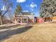 Large backyard featuring a patio, shed, and a spacious lawn area at 6721 S Clayton Way, Centennial, CO 80122