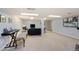 Large basement includes a piano, seating, and ample space for various activities at 6721 S Clayton Way, Centennial, CO 80122