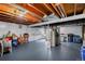 Unfinished basement with exposed ceiling and visible mechanical systems, offering storage space at 6721 S Clayton Way, Centennial, CO 80122