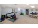 Spacious basement area features an exercise bike, storage, and room for recreation at 6721 S Clayton Way, Centennial, CO 80122