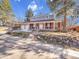Inviting two-story home featuring a welcoming porch and an attached two-car garage at 6721 S Clayton Way, Centennial, CO 80122