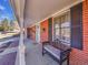 Inviting front porch with seating, showcasing the home's charming curb appeal and architecture at 6721 S Clayton Way, Centennial, CO 80122