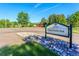 Cherry Knolls Park entrance sign framed by blue skies and lush greenery, inviting exploration and outdoor fun at 6721 S Clayton Way, Centennial, CO 80122