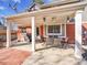 Covered patio with dining set, perfect for outdoor entertaining at 6721 S Clayton Way, Centennial, CO 80122