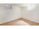 Finished basement bedroom with wood flooring and windows at 3912 S Atchison Way # E, Aurora, CO 80014