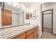 Bright bathroom with granite vanity, shower, and toilet at 3912 S Atchison Way # E, Aurora, CO 80014