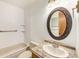 Clean bathroom with granite vanity and oval mirror at 3912 S Atchison Way # E, Aurora, CO 80014