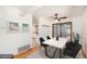 Virtually staged dining room with hardwood floors and sliding door access at 3912 S Atchison Way # E, Aurora, CO 80014