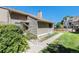 Exterior view of the house, showing walkway and landscaping at 3912 S Atchison Way # E, Aurora, CO 80014