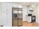 Modern kitchen features stainless steel appliances and white cabinets at 3912 S Atchison Way # E, Aurora, CO 80014