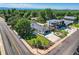Beautiful aerial view of the property showcasing a well-maintained lawn and modern exterior at 3695 E Dartmouth Ave, Denver, CO 80210