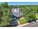 Striking aerial view of the home, showing the well-manicured lawn and peaceful neighborhood at 3695 E Dartmouth Ave, Denver, CO 80210