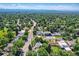 Scenic aerial view of the community, featuring tree-lined streets at 3695 E Dartmouth Ave, Denver, CO 80210