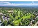 Expansive aerial view of the community, showcasing mature trees and landscape at 3695 E Dartmouth Ave, Denver, CO 80210
