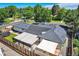 Aerial view showcasing the backyard with a covered patio and outdoor seating area at 3695 E Dartmouth Ave, Denver, CO 80210